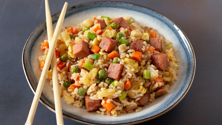Bowl of Korean Spam fried rice with chopsticks