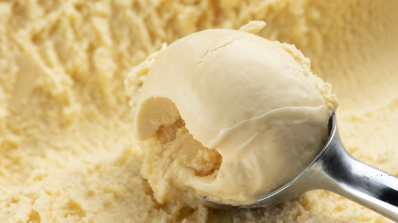 Scooping vanilla ice cream