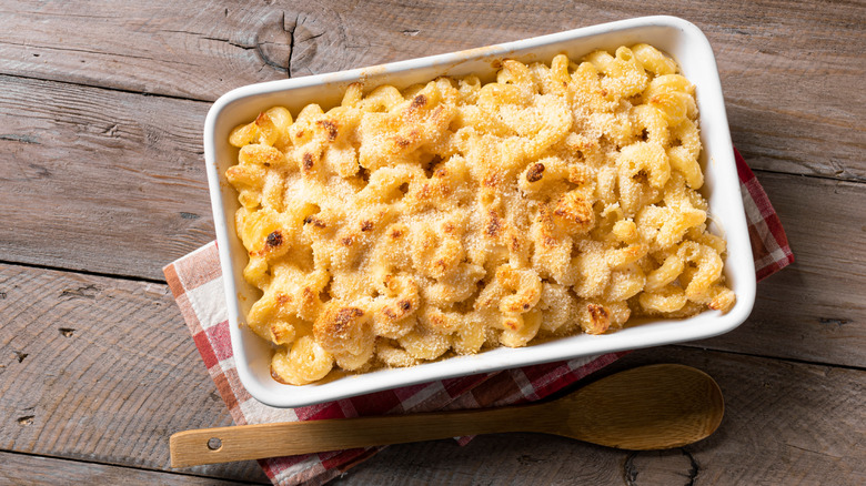 Baked mac and cheese in a white baking dish