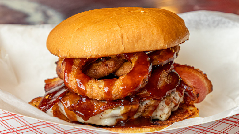 burger with bacon and onion rings