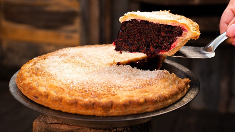 Person lifting a slice of Knott's boysenberry pie