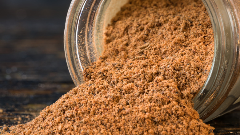 old bay seasoning spilling out of a glass container