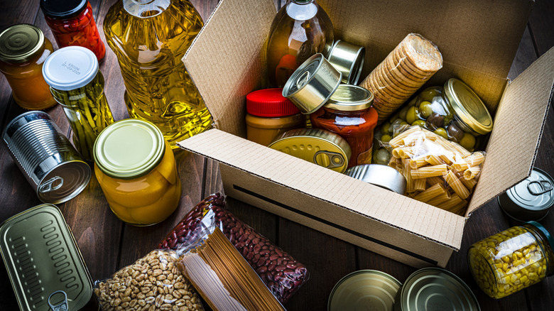 A box and table filled with shelf stable foods