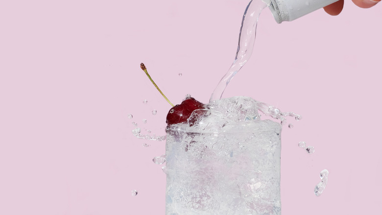 Club soda going into drink