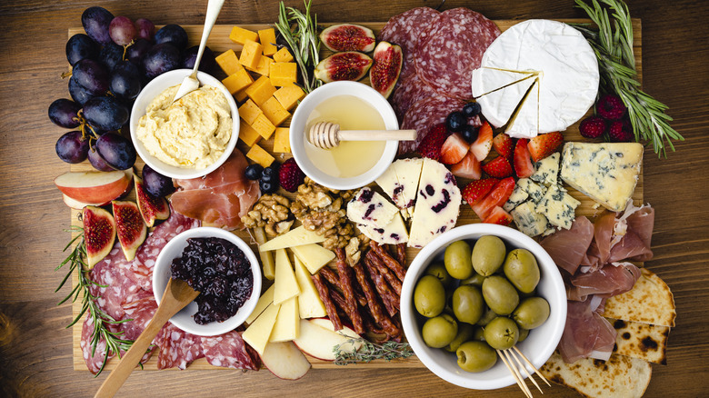 charcuterie board with cheese, meats, and more