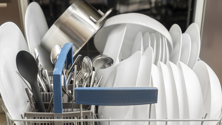 Clean dishes in a dishwasher.
