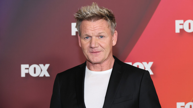 Gordon Ramsay looking into the camera in a black blazer and white shirt