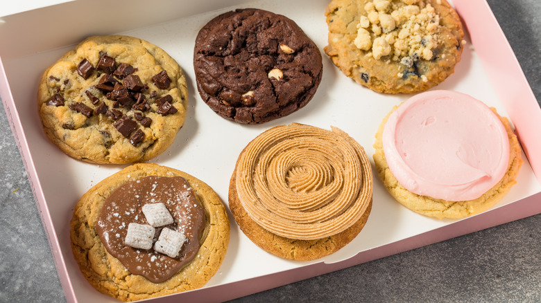 A box of gourmet Crumbl cookies, mixed flavors