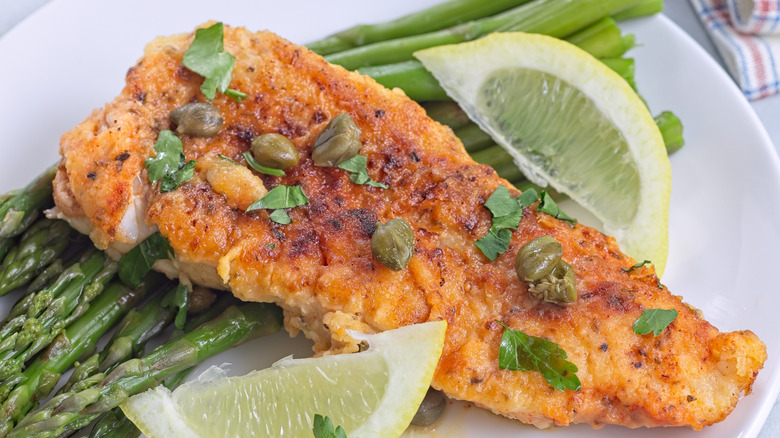 fried haddock served with lemons and capers