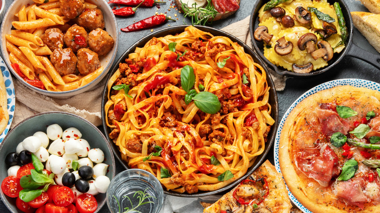 various classic italian foods on a table