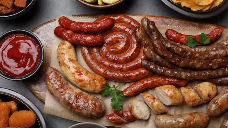 A platter of different types of juicy sausages artfully presented