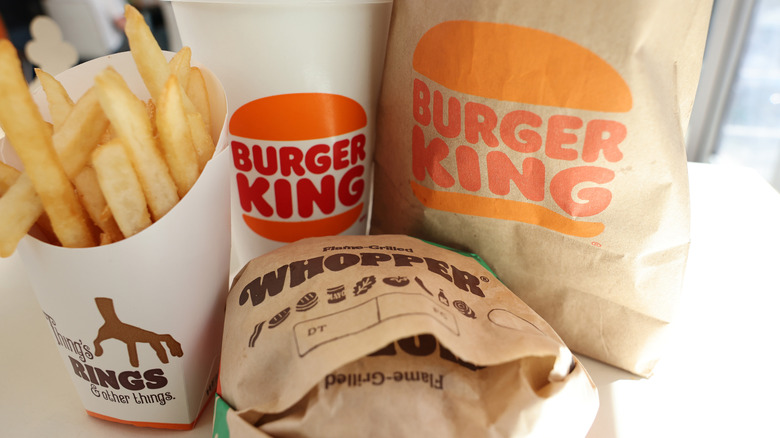 a burger king whopper, drink and fries