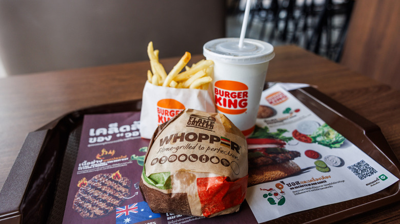 a burger king whopper, drink and fries