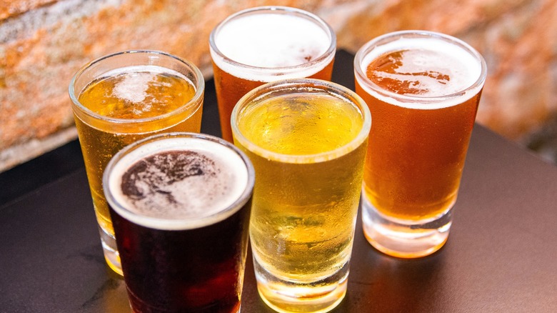 Several beer varieties in pint glasses.