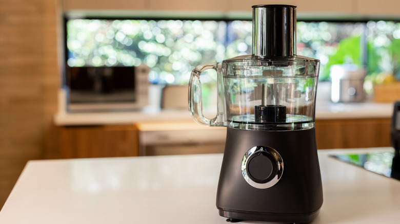 A food processor on a kitchen counter