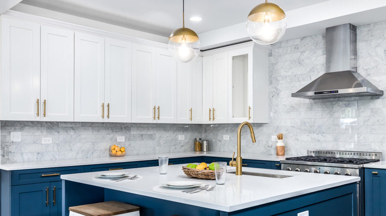 Kitchen with textured white and gray subway tile