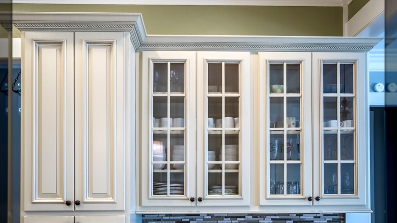 White glass front cabinets in a kitchen