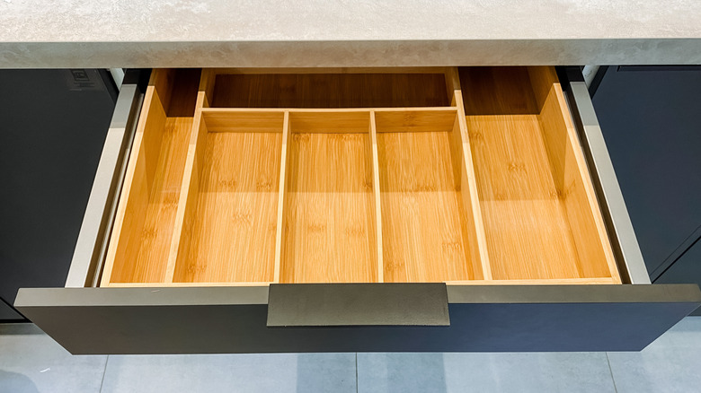 a silverware tray in a kitchen drawer