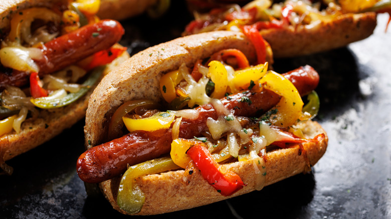 Sausage in a bun dressed with peppers