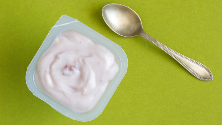 Yogurt tub with a spoon