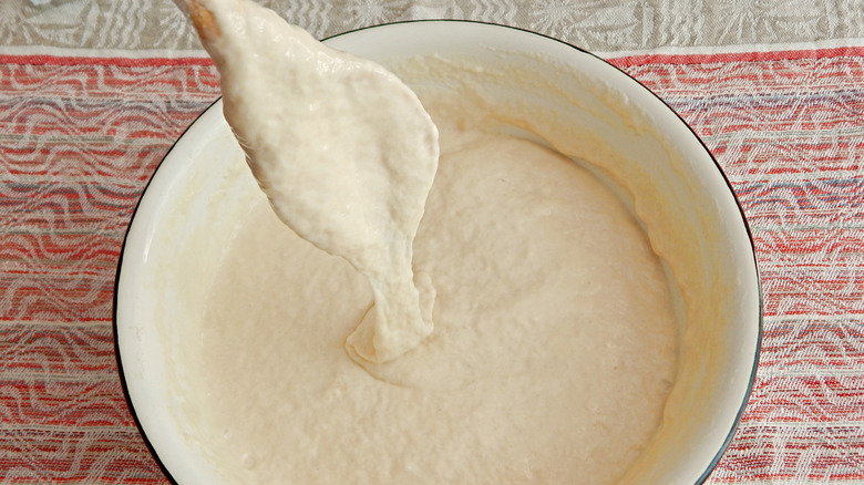 raw pancake batter in a ceramic bowl