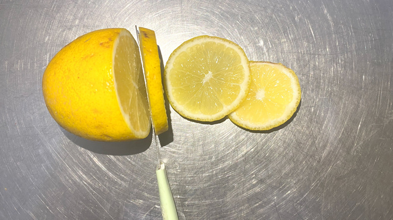 Lemon on a clean stainless steel surface