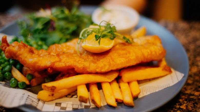 Fish and chips with a lemon cheek