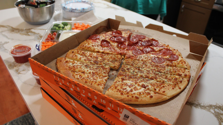Boxes of Little Caesars pizza on counter