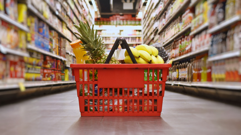 groceries in a basket on the ground in a store