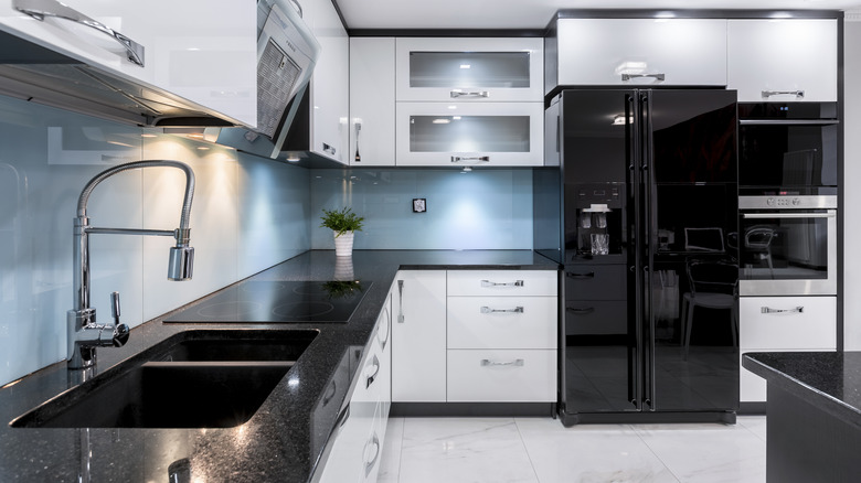 kitchen with black appliances and counters