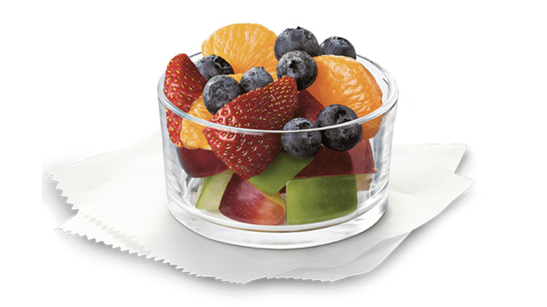 A clear bowl holds the contents of a Chick-fil-A Fruit Cup.