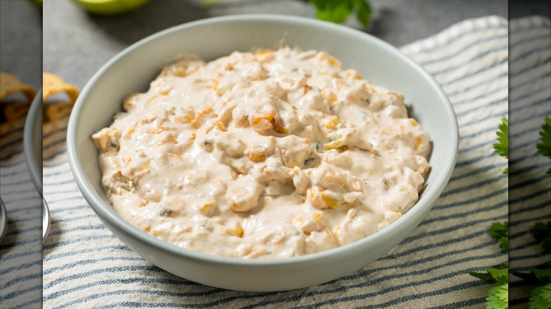 fresh elote street corn dip in a white bowl