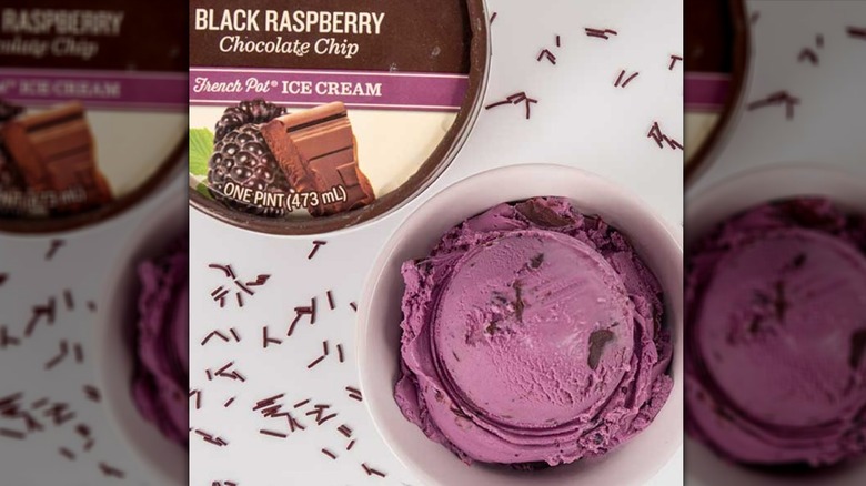 Graeter's Black Raspberry Chocolate Chip ice cream in a white bowl surrounded by sprinkles