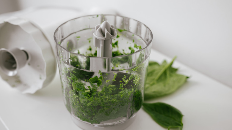 Spinach diced in a food processor.