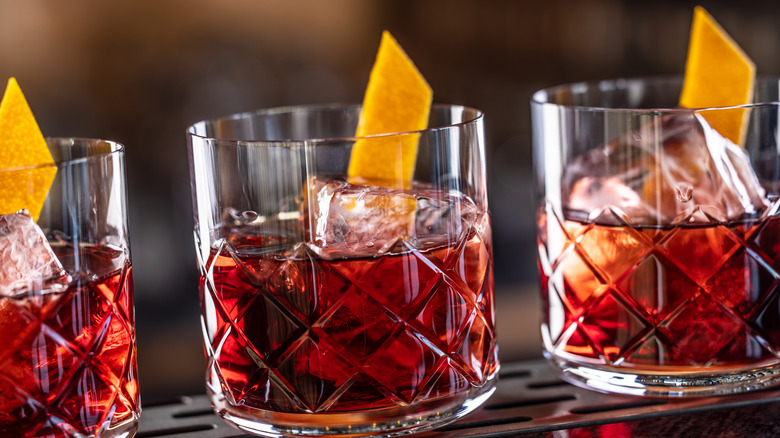 A trio of Negronis served in rocks glasses