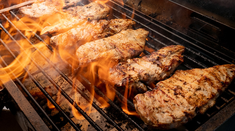 Chicken cooking on a grill