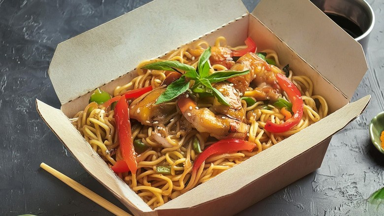 Noodles in a takeout container