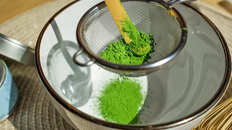 Matcha sifted into bowl