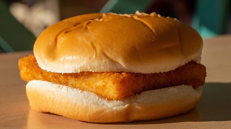McFish burger on a wooden table.