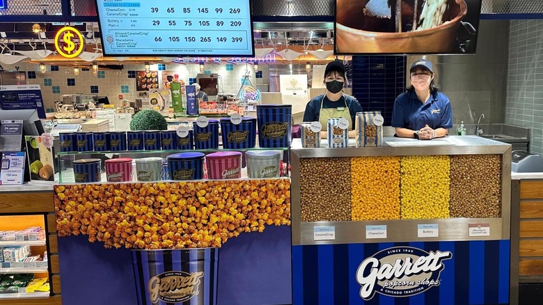 Garrett popcorn store interior with two employees behind the counter