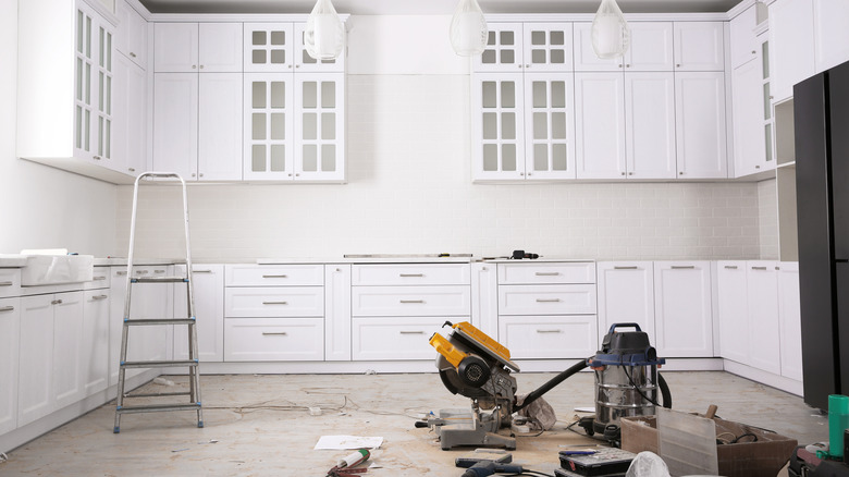 kitchen mid-remodel with tools in the foreground