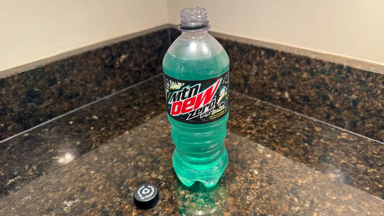 An open bottle of Mountain Dew zero-sugar Baja Blast on a kitchen counter