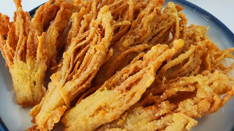 Fried enoki mushrooms on plate