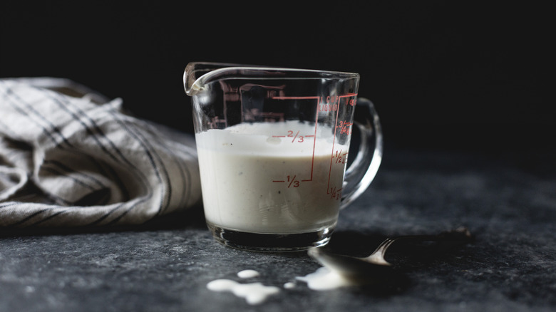buttermilk in a class measuring cup