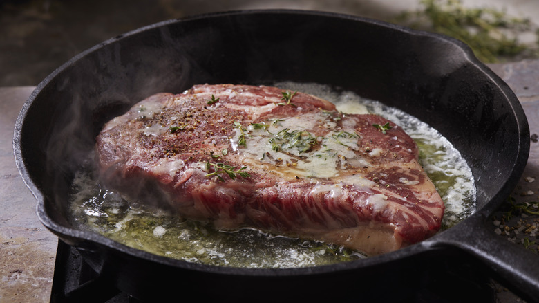 Meat searing in pan