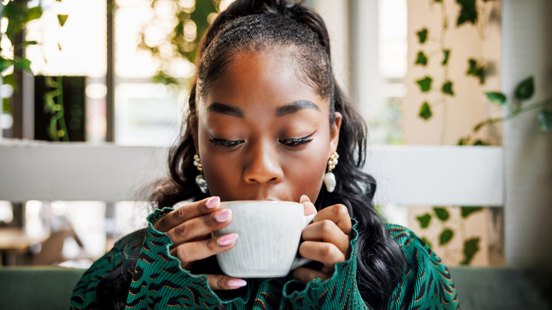 Woman drinking a cup of coffee