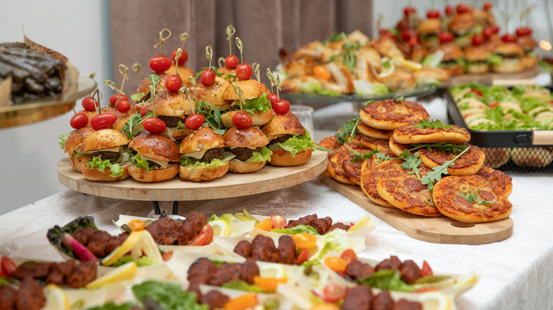 Buffet table with sandwiches and appetizers