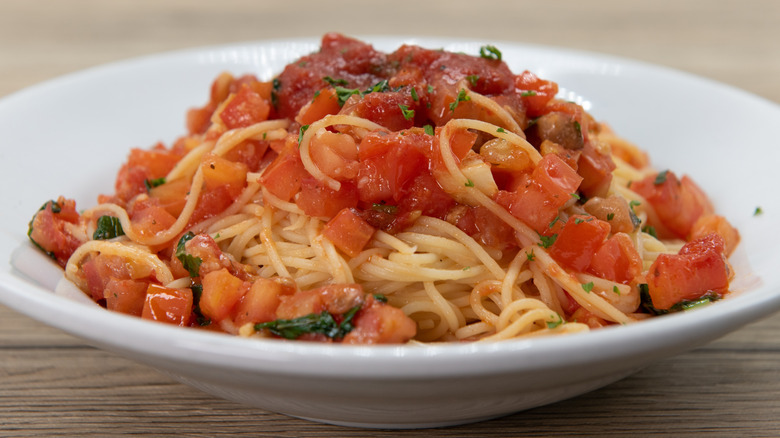Close-up of pasta alla checca served in a white plate