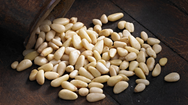 Pine nuts spilling out of cup