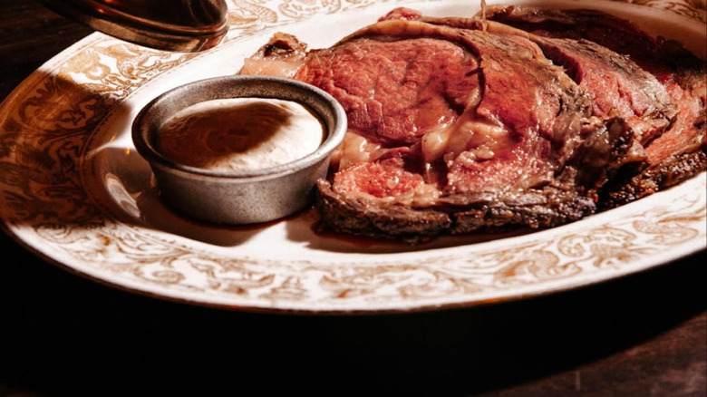 Jus is poured over the beef at 4 Charles Prime Rib.